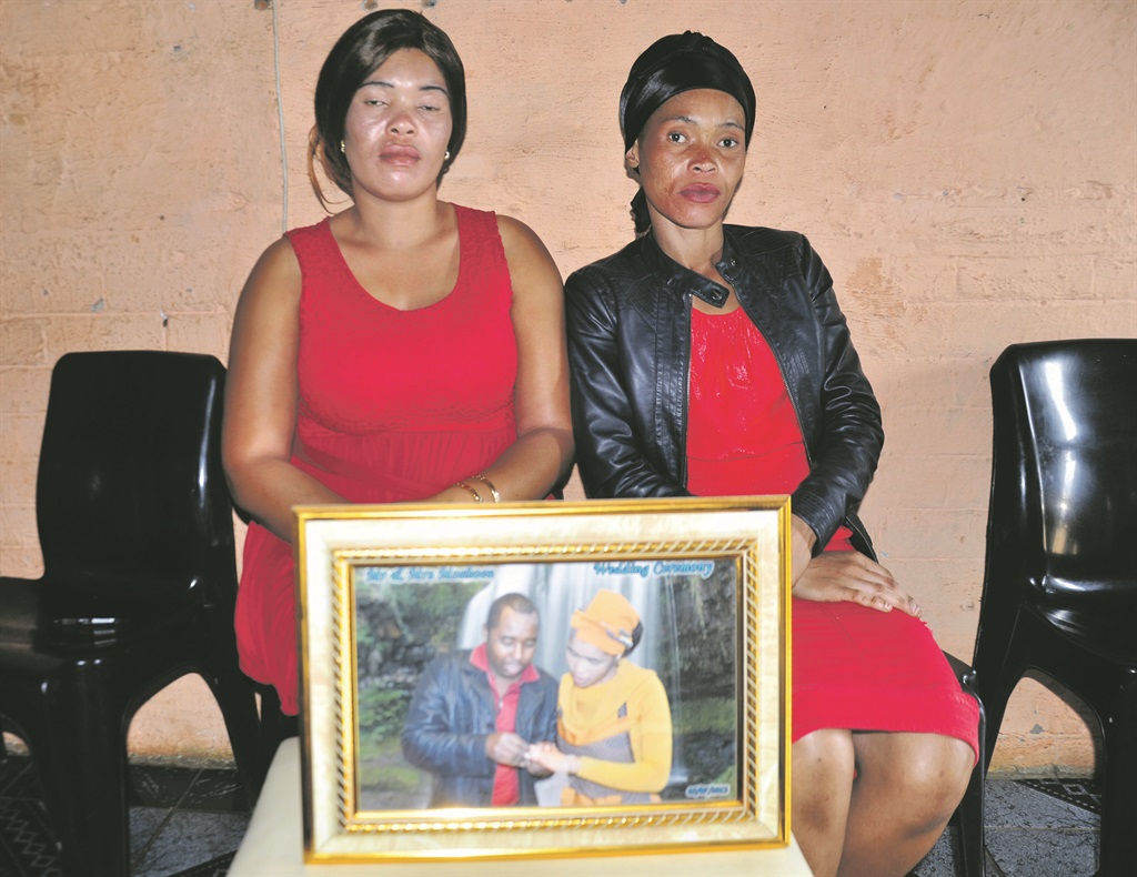 From left: Martin Moshoiu’s sister-in-law Noxolo Majenge and his wife Nomcebisi.       Photo by Kabelo Tlhabanelo