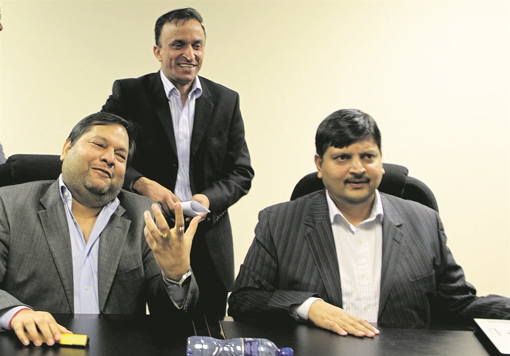 Ajay and Atul Gupta and Jagdish Parekh (standing) during an interview with City Press at The New Age newspaper offices in Midrand. Picture: Muntu Vilakazi/City Press