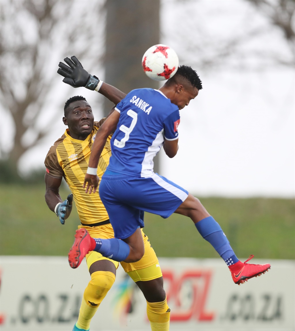 Richard Ofori punches clear of teammate Pogiso Sanoka of Maritzburg United 