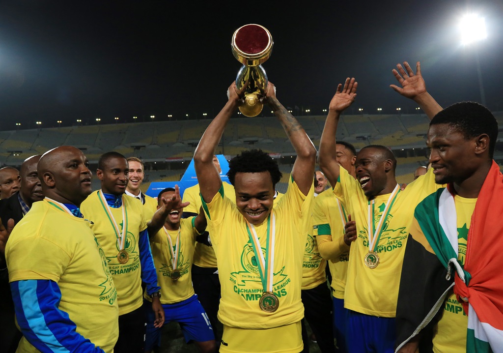Percy Tau celebrates with the trophy after Sundowns win the 2016 CAF Champions League Final beating Zamalek 3-1 on aggregate at the Borg El Arab Stadium in Alexandria, Egypt on 23 October 2016 Â©Gavin Barker/BackpagePix,