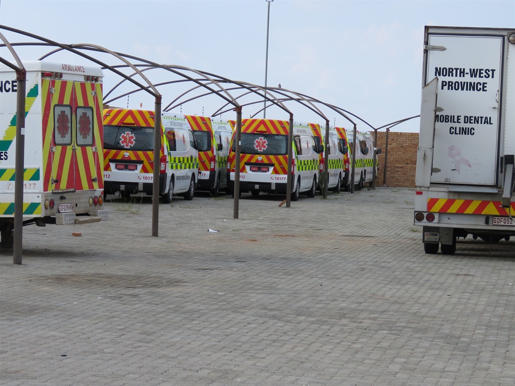 New ambulances parked at the North West health department offices for the past three months, waiting to be registered and licensed. Picture: Poloko Tau/City Press