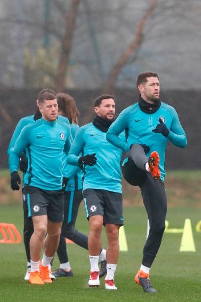 (L-R) Chelsea's English midfielder Ross Barkley, Chelsea's English midfielder Danny Drinkwater and Chelsea's English defender Gary Cahill attend a training session at Chelsea's Cobham training facility in Stoke D'Abernon