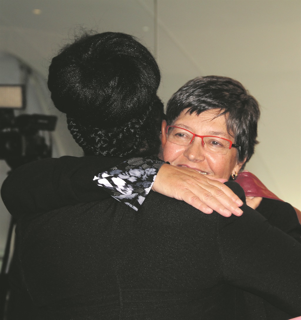 LEGAL VICTORY Advocate Lilla Crouse hugs one of the family members following the Life Esidimeni arbitration hearing ruling. Picture: Collen Mashaba