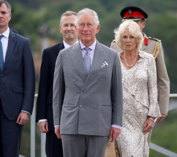 Prince Charles and Camilla attend a wreath-laying 