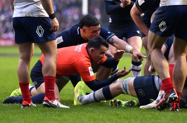 Referee Nic Berry signals that the ball is held up as Sam Skinner of Scotland (obscured) attempts to score a try during the Six Nations against France at Murrayfield on Saturday. (Photo by Stu Forster/Getty Images)