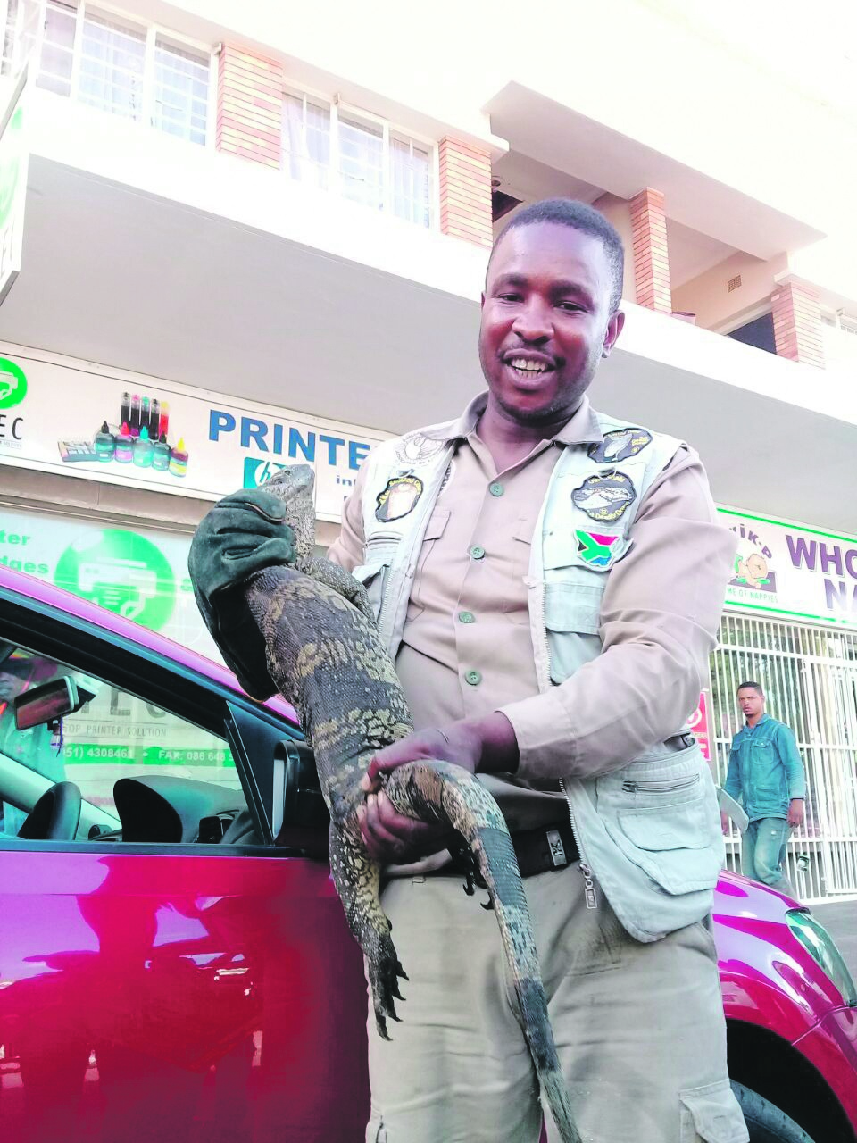 Residents called Harry Baloyi to remove a big lizard that was stuck underneath a car on Wednesday. 