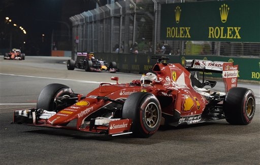Ferrari's Sebastian Vettel dominated the 2015 Singapore GP. Meanwhile plenty of drama unfolded including crashes, shunts and a fan walking along the track!