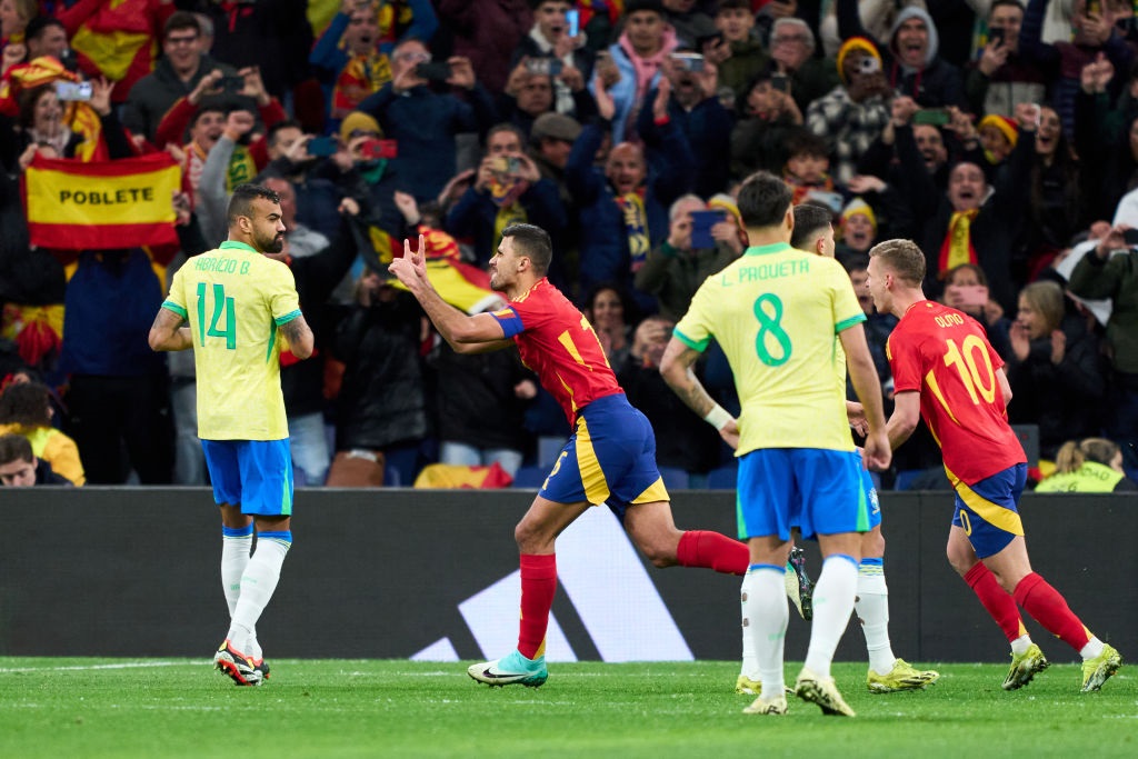 MADRID, SPAIN - MARCH 26: Rodri Hernandez of Spain celebrates after scoring his teams first goal during the friendly match between Spain and Brazil at Estadio Santiago Bernabeu on March 26, 2024 in Madrid, Spain. (Photo by Juan Manuel Serrano Arce/Getty Images)