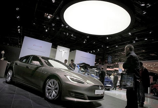 <b>SELF-DRIVING REVOLUTION:</b> All Teslas in production will be equipped with the automaker's self-driving hardware. <i>Image: AP / Christophe Ena</i>