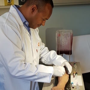 Sales representative for BD, Alex Buckton, demonstrates how blood samples can be taken in a safe way.
