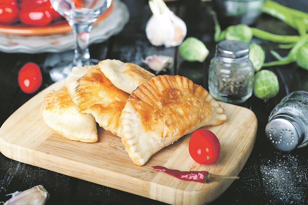 49245615 - fresh baked pasties filled with meat and vegetablesPhoto by 