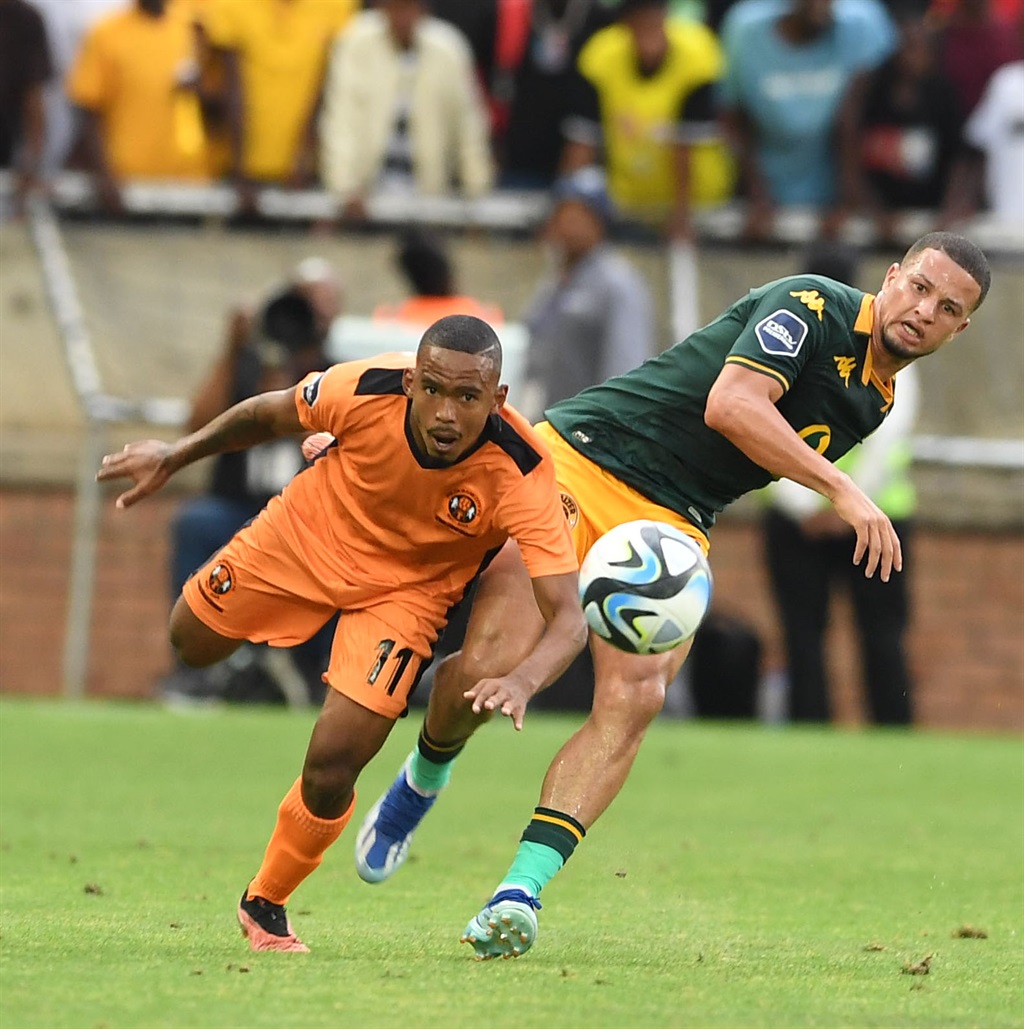Oswin Appollis of Polokwane City and Yusuf Maart of Kaizer Chiefs during the DStv Premiership match between Polokwane City and Kaizer Chiefs at Peter Mokaba Stadium on December 09, 2023 in Polokwane, South Africa. 