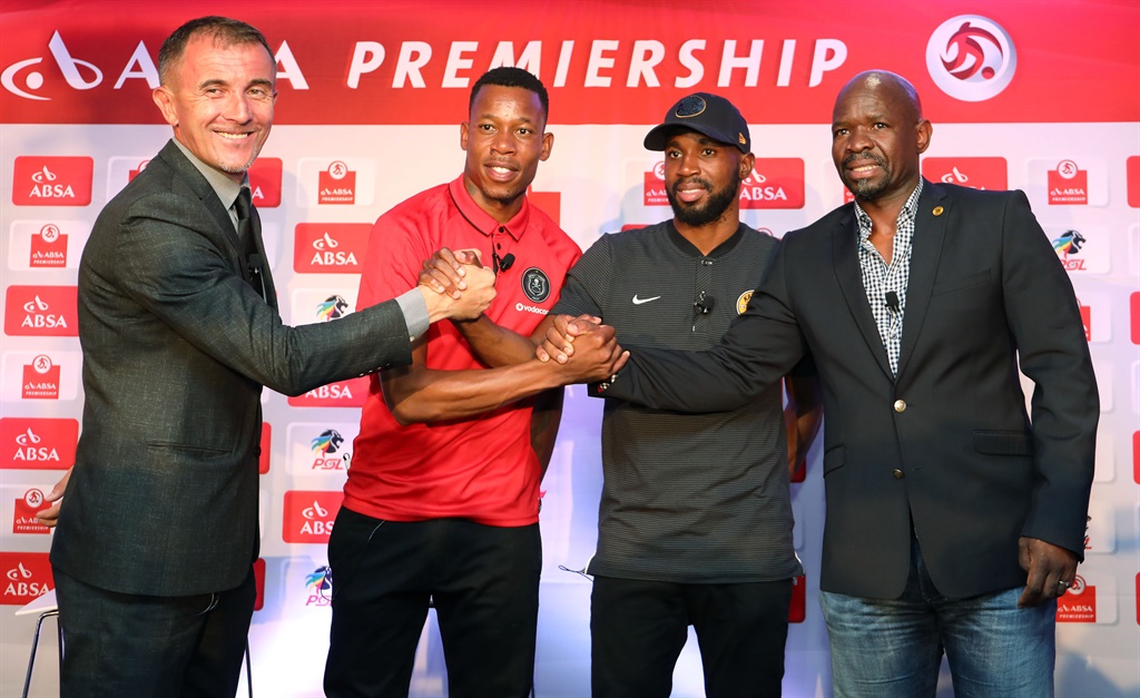 Orlando Pirates coach Milutin Sredojevic and captain Happy Jele (left) grip the hands of their Kaizer Chiefs rivals Ramahlwe Mphahlele and head coach Steve Komphela ahead of the Soweto derby on Saturday.   