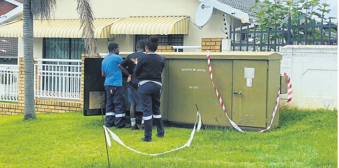 Municipal workers at a power box in Scorpio Drive, Northdale which also caught fire.