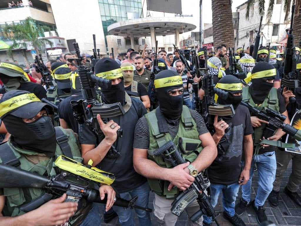 Masked militants of the Palestinian Fatah movement