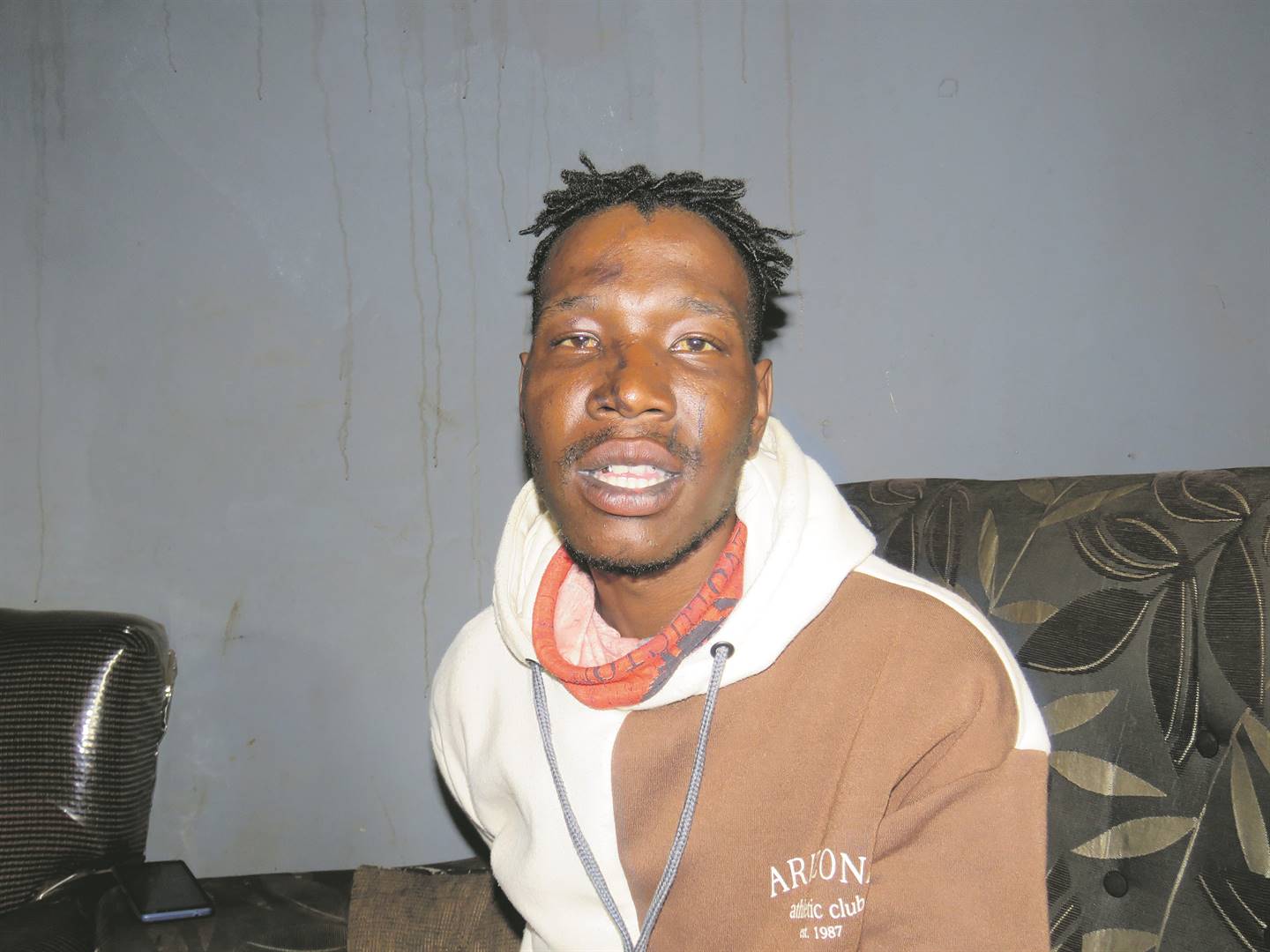 BEKU ROUGH!: Simphiwe Ngobeni, who was moered after being accused of stealing booze from a tavern, shows his injuries (inset).          Photos by                                Ntebatse Masipa 