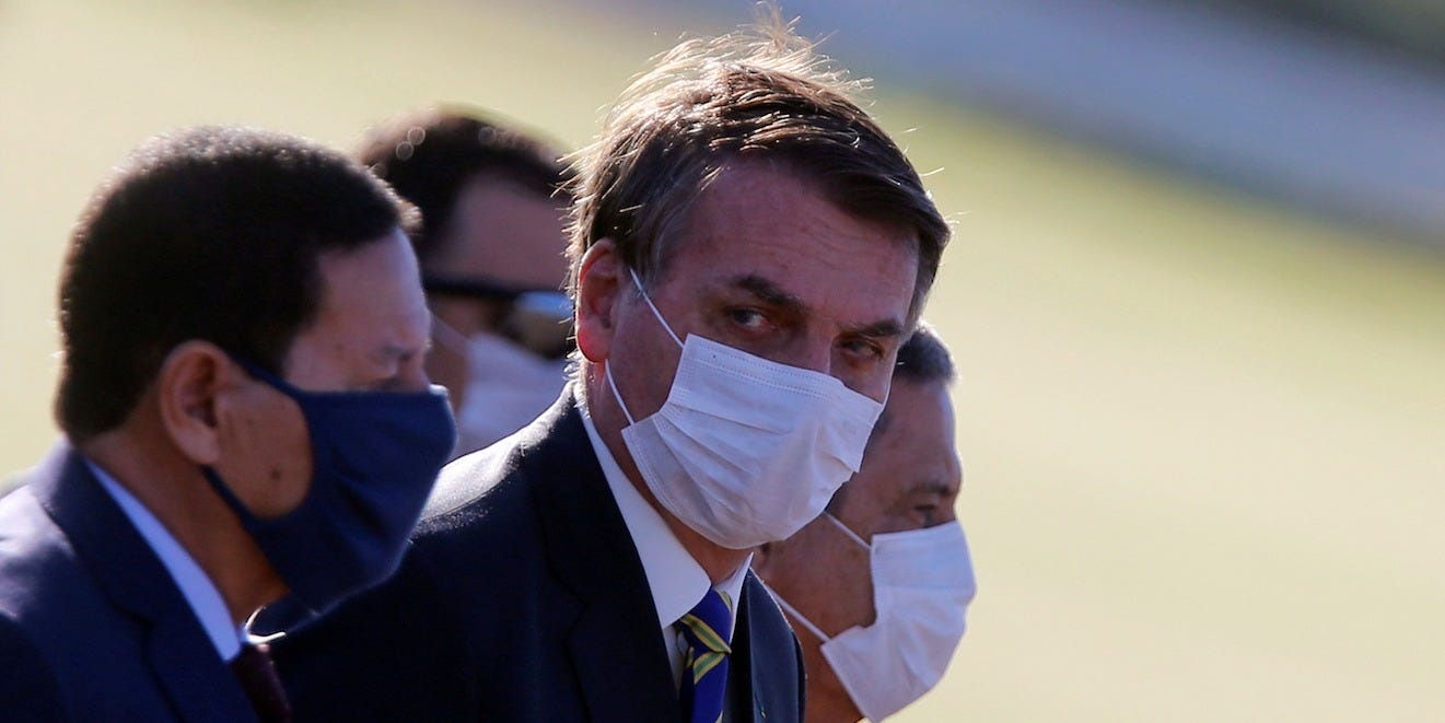 Brazil's President Jair Bolsonaro wearing a protective mask at a ceremony in front the Alvorada Palace in Brasilia on May 12, 2020.