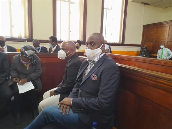<em>Former Gauteng Health MEC Brian Hlongwa, his wife Joelene and other co-accused seated in the Johannesburg Magistrate's Court. They are expected to bring a formal bail application today. (</em><em>Ntwaagae Seleka, News24)</em>