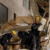 Jordan rescuers search for 10 missing under collapsed building