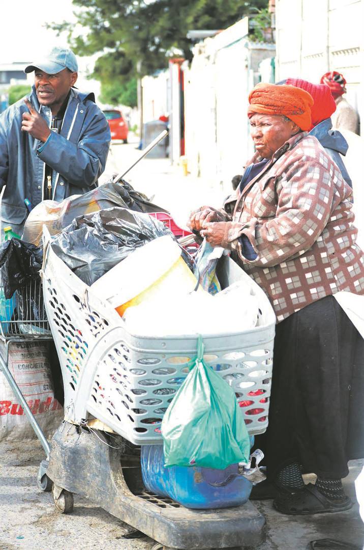 Gogo Madlalwiseni Tsoka and Richard Frans earn a living from recycling waste in Kosovo, Cape Town.   Photo by Lulekwa Mbadamane