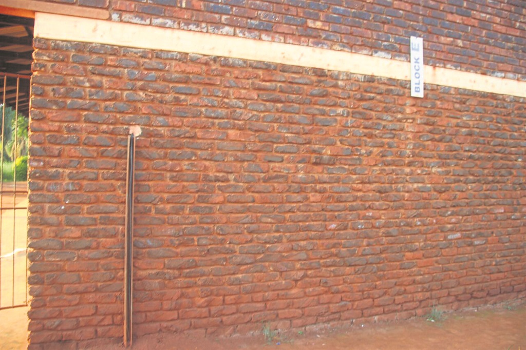 Vhuthuhawe Madala was electrocuted by the electric cable on this wall (left).Photo by        Armando Chikhudo