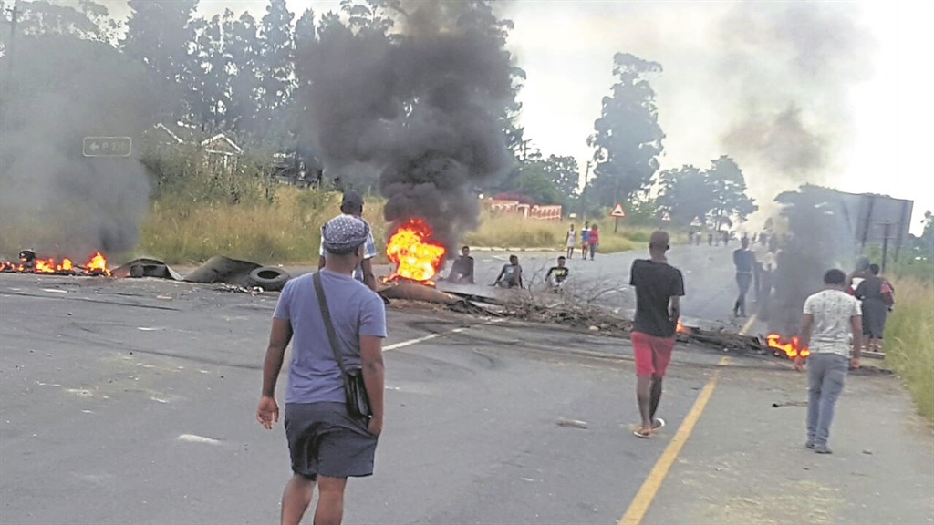 Residents blocked roads with burning tyres and rubble.