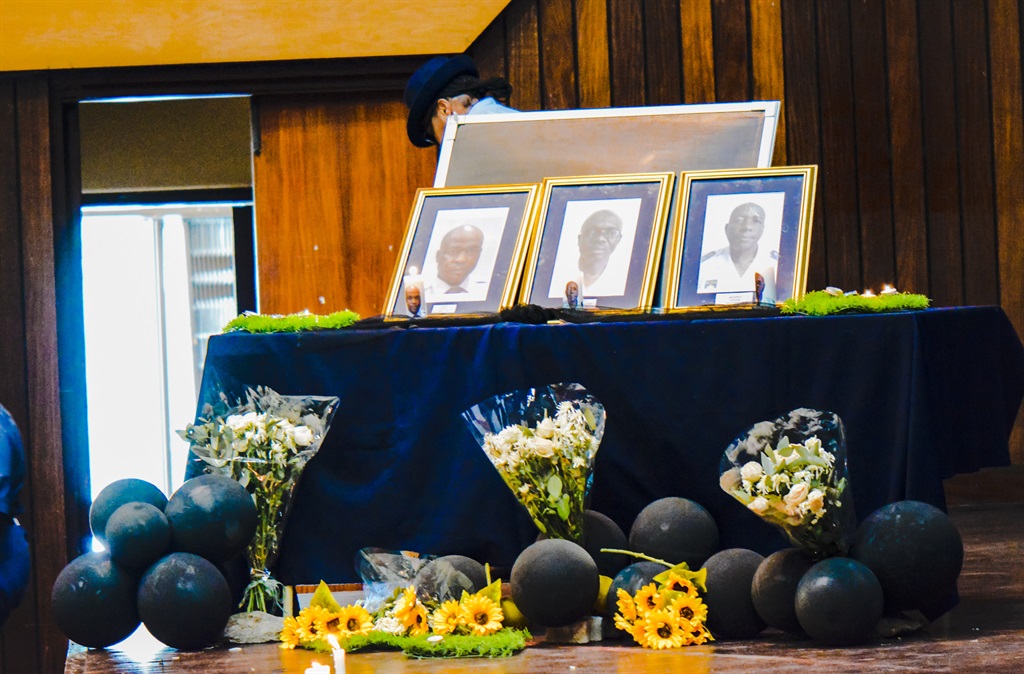 Photos of deceased officers at memorial