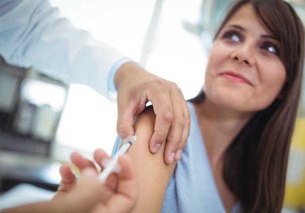 woman receiving flu vaccine