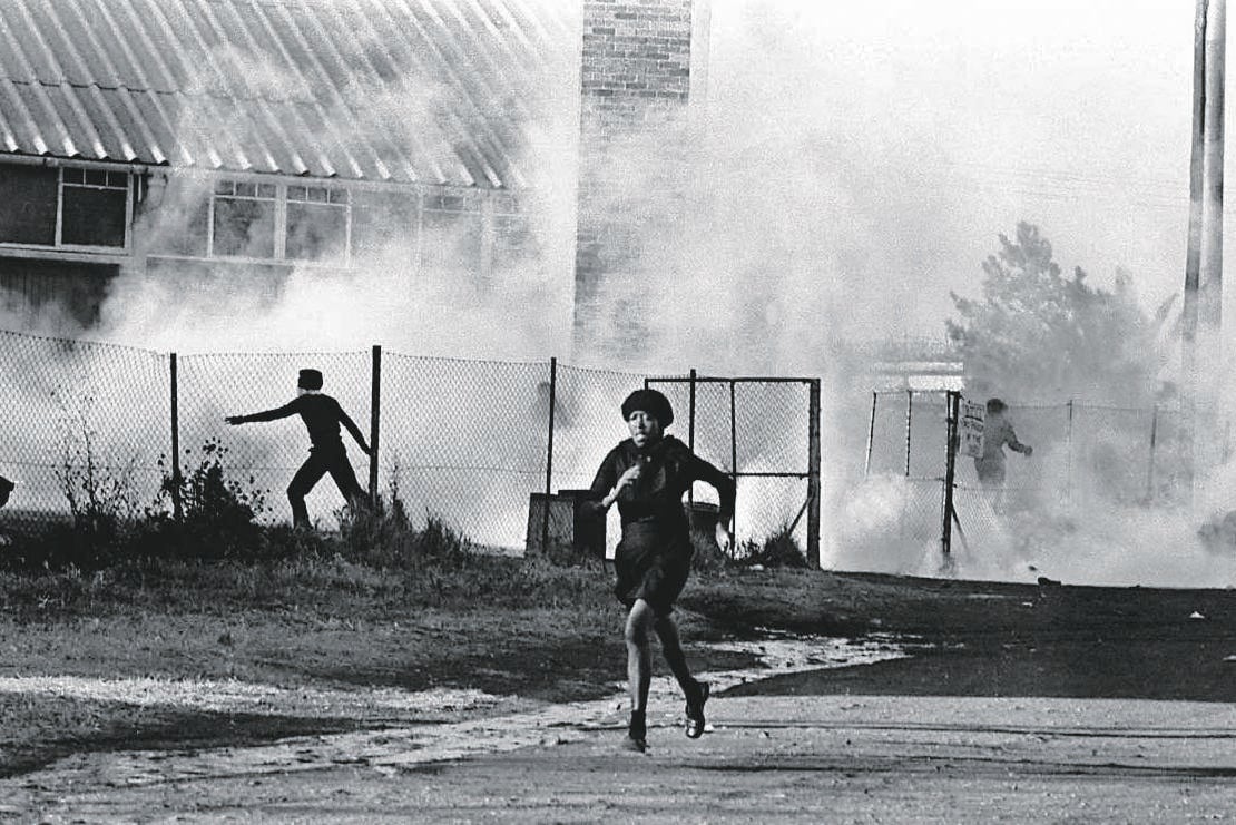  A woman runs from the police during June 16 1976 Soweto riots    Picture: Bongani Mnguni