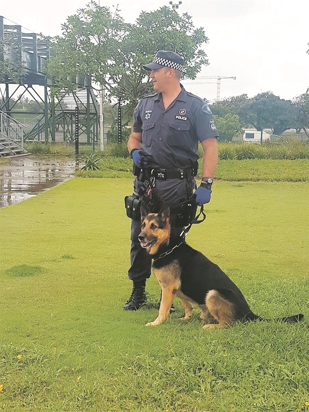 Metro police cop Dion Carstensen with a German Shepherd named Ruger. 