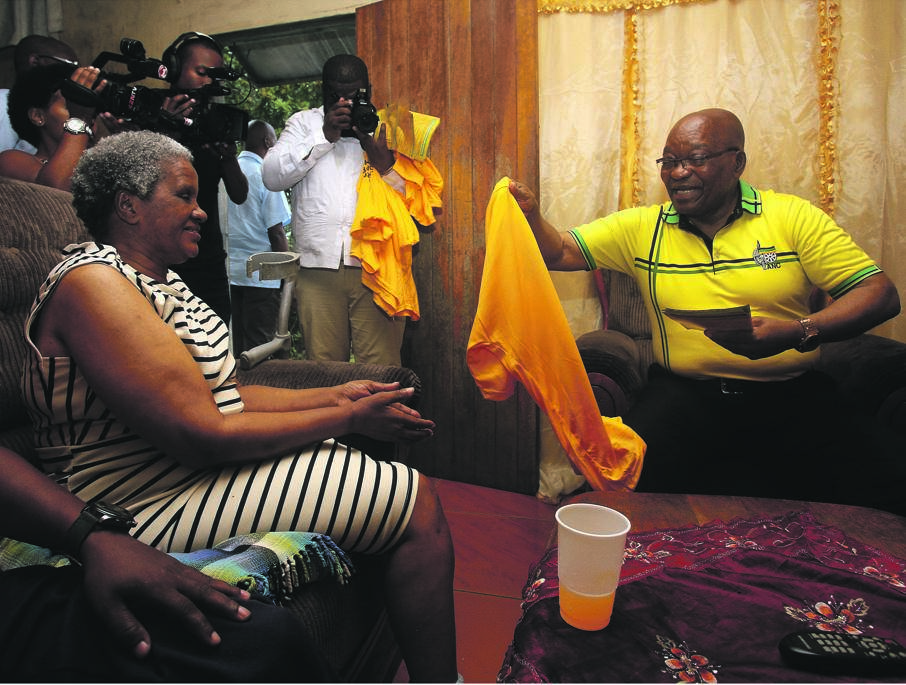 Walking-challenged Hannah Xulu from Esikhawini receives an ANC T-shirt from former president Jacob Zuma. Picture: Sibusiso Ndlovu