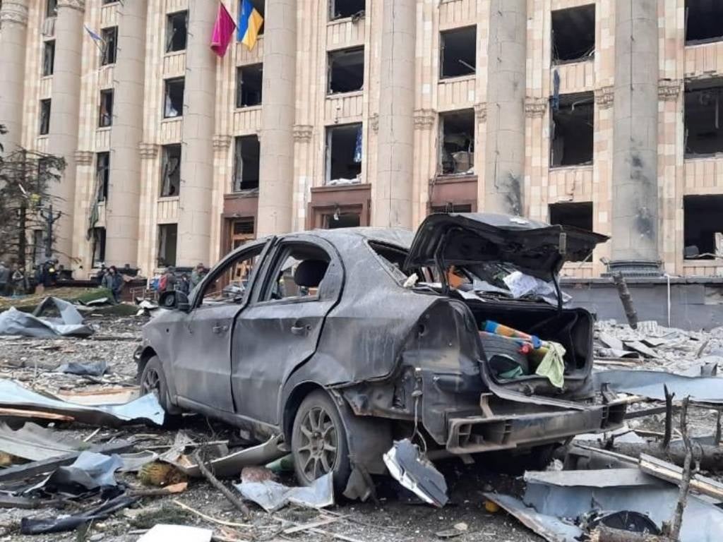 A view of damaged Kharkiv governor's office and a wrecked vehicle is seen after Russian army's missile attack in Kharkiv, Ukraine. 