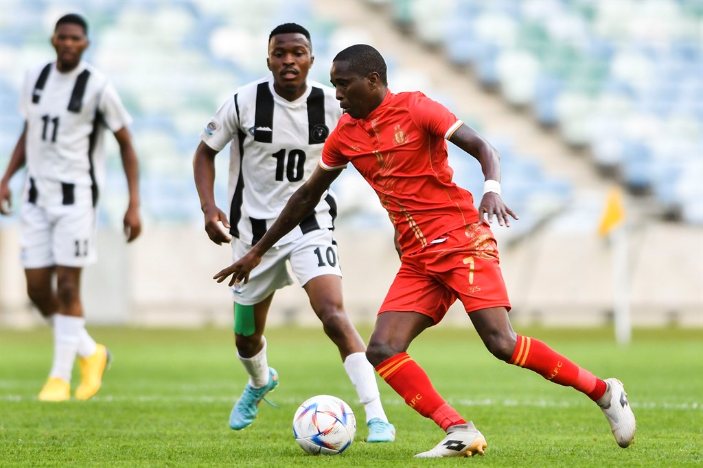 DURBAN, SOUTH AFRICA - SEPTEMBER 16: Elias Pelembe of Royal AM and Philani Thabo Mkhontfo, captain of Mbabane Highlanders  during the CAF Confederation Cup 1st preliminary round, leg 2 match between Royal AM and Mbabane Highlanders at Moses Mabhida Stadium on September 16, 2022 in Durban, South Africa. (Photo by Darren Stewart/Gallo Images)