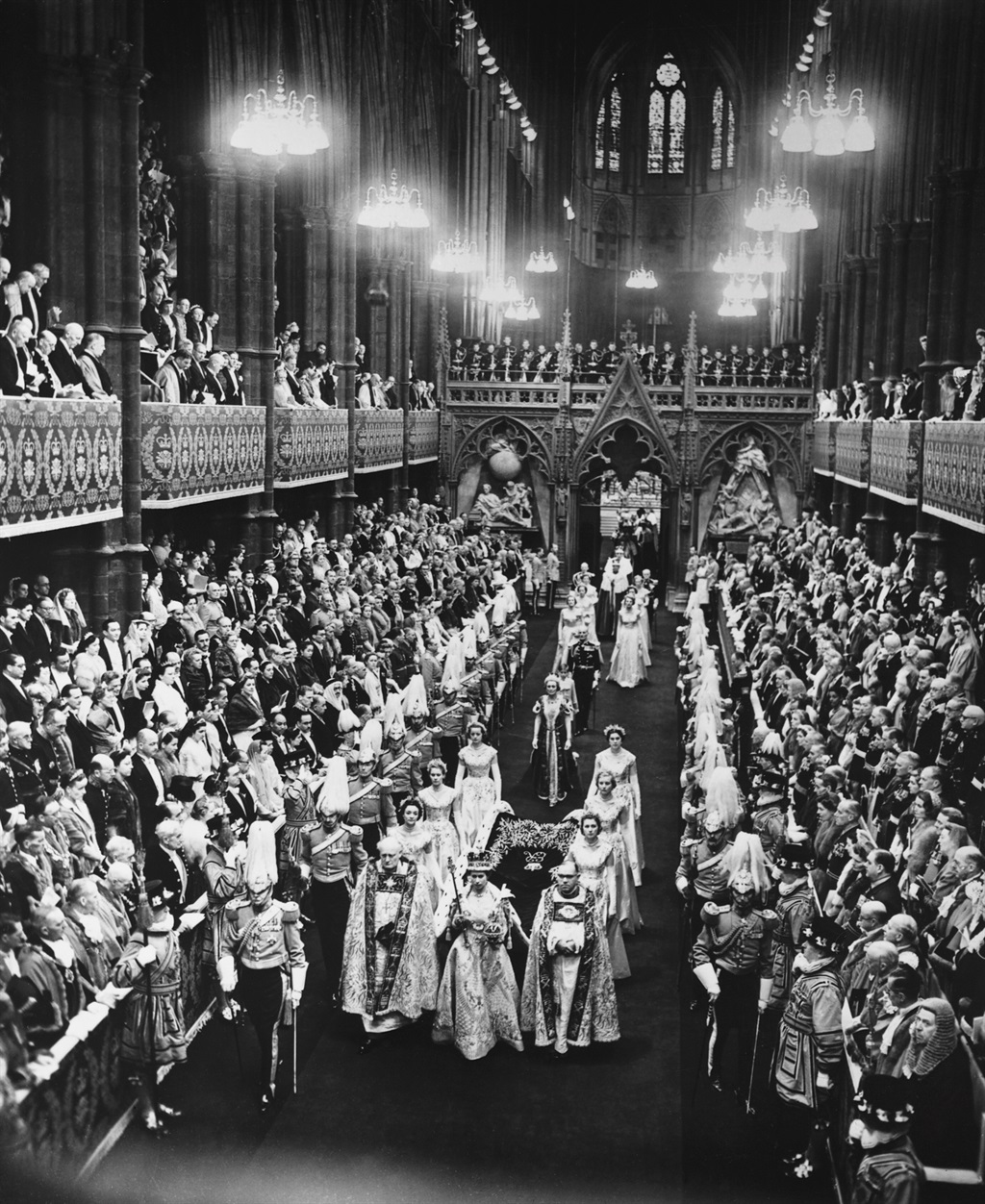 Queen Elizabeth II walks down the nave of Westminster