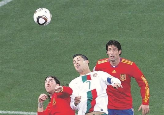 Joan Capdevila (No 11) and his Spain team-mate Sergio Ramos sandwich Portugal’s Cristiano Ronaldo during their World Cup clash in Cape Town in 2010. Photo: Oleg Popov/Reuters