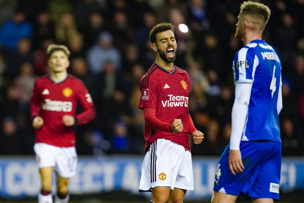 Manchester United's Bruno Fernandes celebrates scoring their side's second goal of the game from a penalty during the Emirates FA Cup Third Round match at the DW Stadium, Wigan. Picture date: Monday January 8, 2024. (Photo by Nick Potts/PA Images via Getty Images)