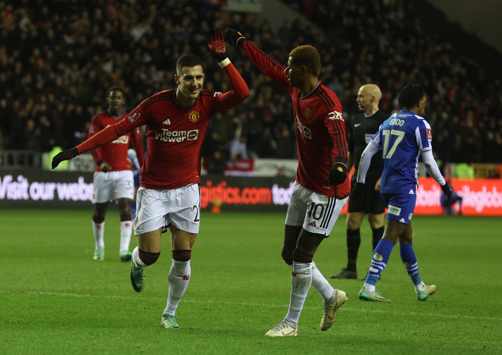 WIGAN, ENGLAND - JANUARY 08: Diogo Dalot of Manchester United celebrates scoring their first goal during the Emirates FA Cup Third Round match between Wigan Athletic and Manchester United  at DW Stadium on January 08, 2024 in Wigan, England. (Photo by Matthew Peters/Manchester United via Getty Images)