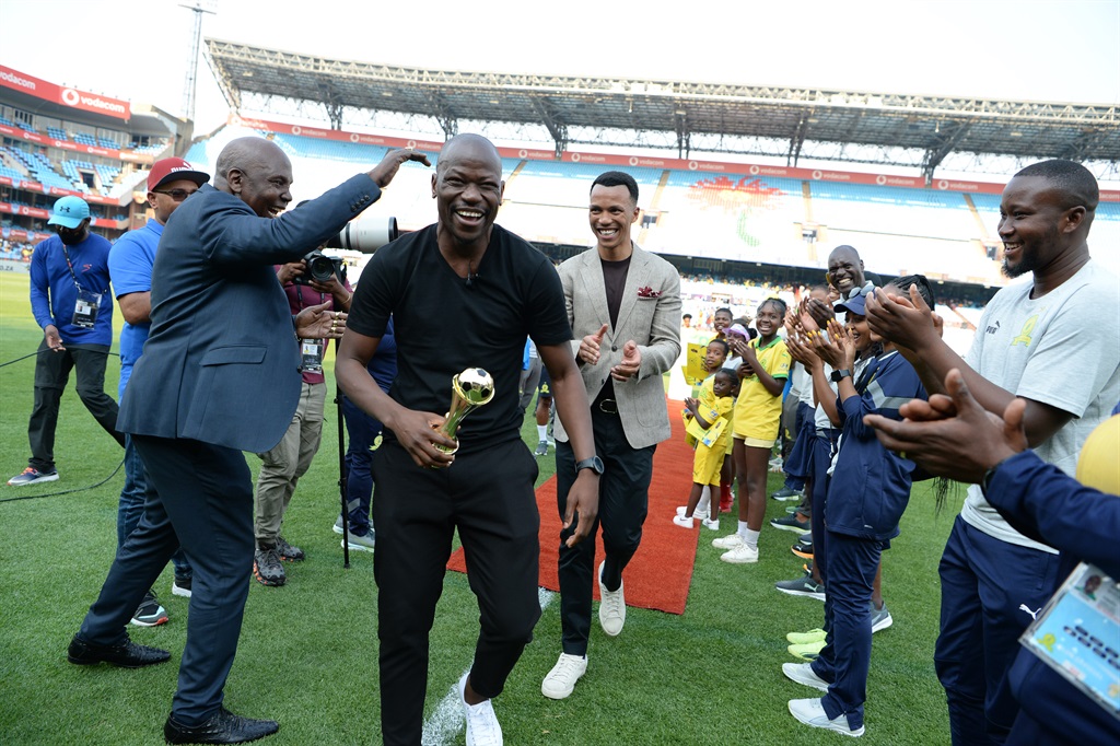 Mamelodi Sundowns Chairman Thlopie Motsepe gives former captain Hlompho Kekana an award during the DStv Premiership match between Mamelodi Sundowns and AmaZulu FC at Loftus Versfeld Stadium.