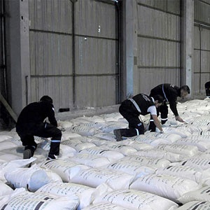 rgentine police officers inspect 920 bags of seized special rice fused with some 20-30 kilos of liquid cocaine in Buenos Aires Photo: AFP
