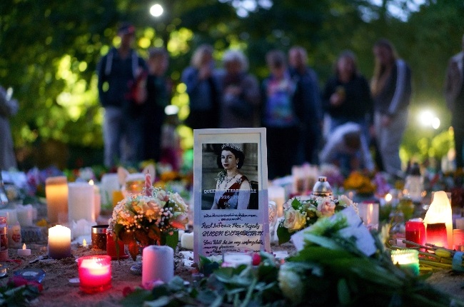 Floral tributes and candles from members of the public were laid in Green Park near Buckingham Palace ahead of the funeral Queen Elizabeth II's funeral.