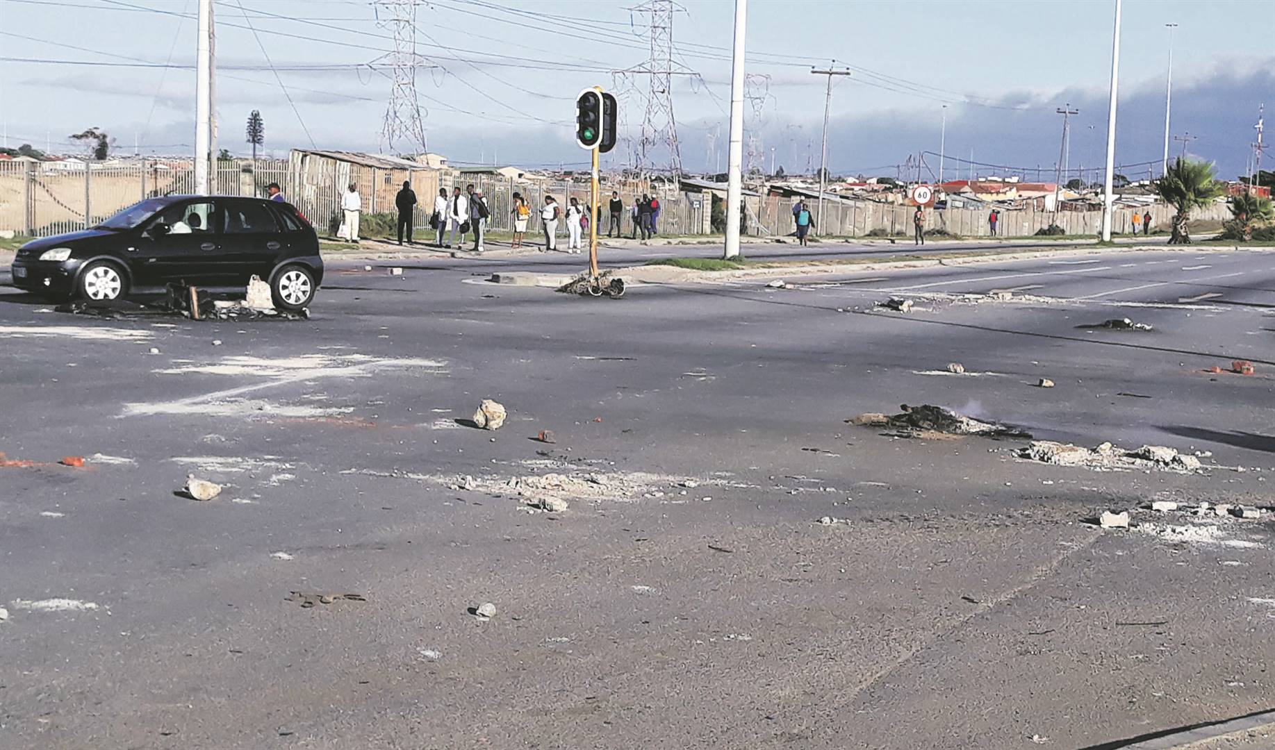 What remained after the police had dissolved a protest of Motherwell township’s Asinavalo informal settlement.                                                                                        Picture: Nosipiwo Manona
