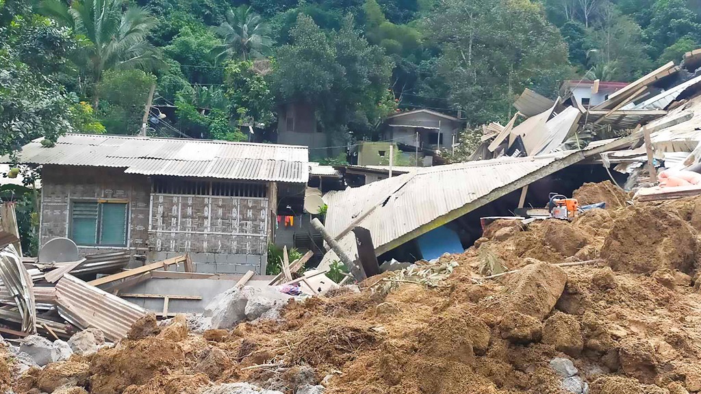 Damaged properties at the site of a landslide in Maco, Davao de Oro following a landslide. 