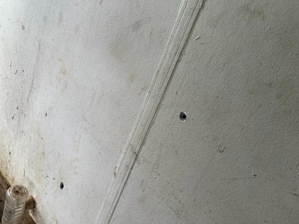Bullet holes in wall