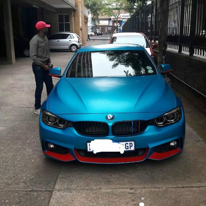 Ndumiso Mabena with his BMW convertible. 
