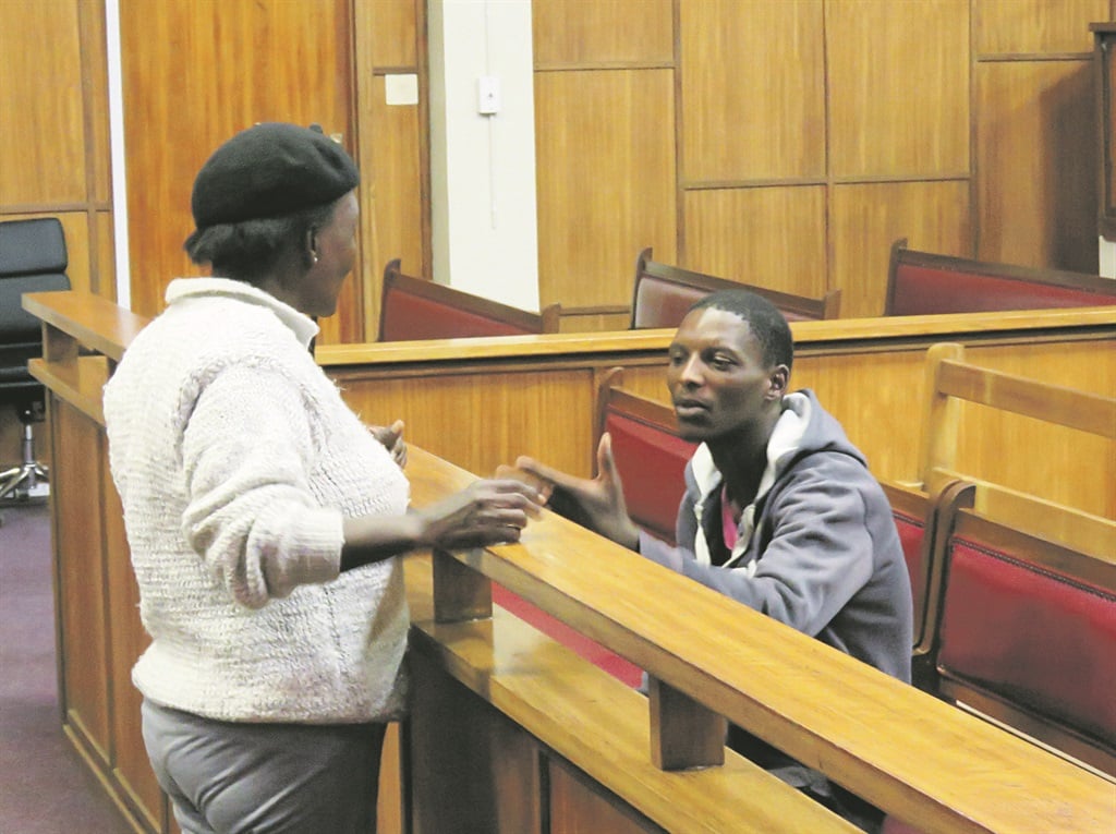 naughty Tefelo Dikole talking to his mother in court