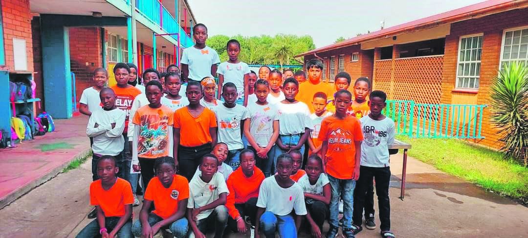 Residents, including pupils from schools in Wattville and Daveyton, wore orange to honour Bokgabo Poo.