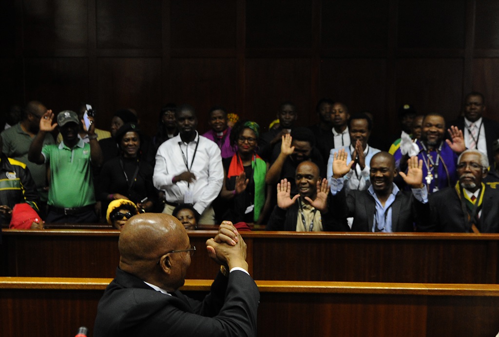 Former president Jacob Zuma turns to acknowledge his supporters in court. Picture: Felix Dlangamandla/Netwerk24