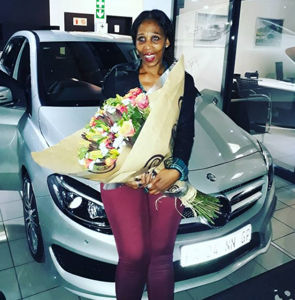 DJ Black Coffee's mother in law, Bongi Mlotshwa with her brand new set of wheels. Photo: Instagram