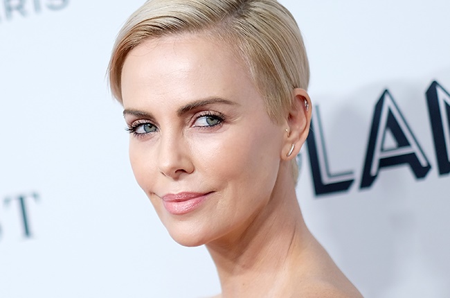 Hollywood glam Charlize Theron appears to like to bend the truth a little, writes the author. 
