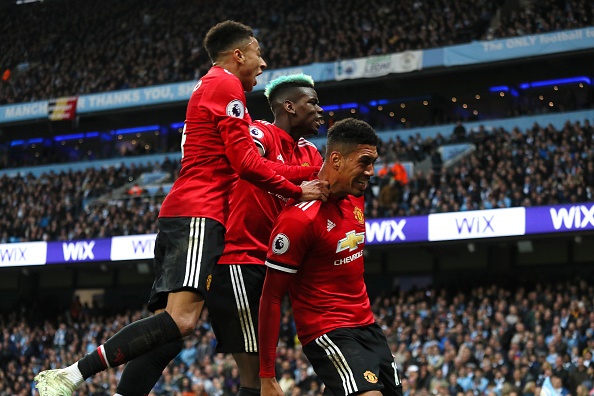  Chris Smalling of Manchester United celebrates scoring a goal to make the score 2-3 with Paul Pogba and Jesse Lingard